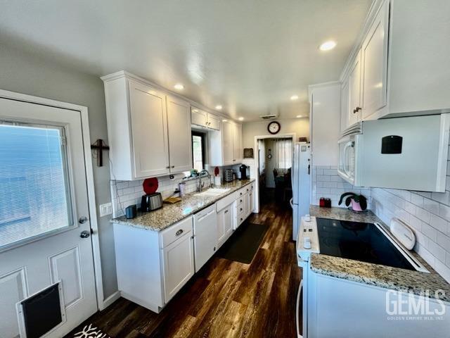 Undisclosed Address Bakersfield, CA 93306 - Photo 6 of 25 a kitchen with a sink stove and refrigerator