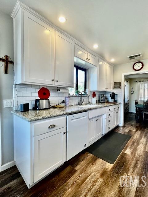 Undisclosed Address Bakersfield, CA 93306 - Photo 9 of 25 a kitchen with stainless steel appliances a sink window and cabinets