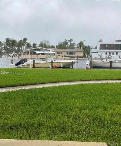 a swimming pool with outdoor seating and yard