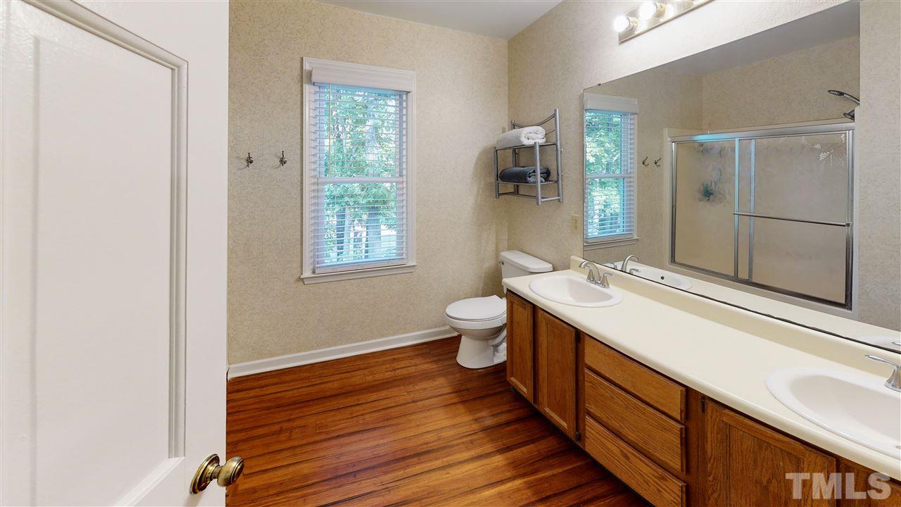 123 Abercrombie Road Wake Forest, NC 27587 - Photo 15 of 27 a bathroom with a sink and a mirror