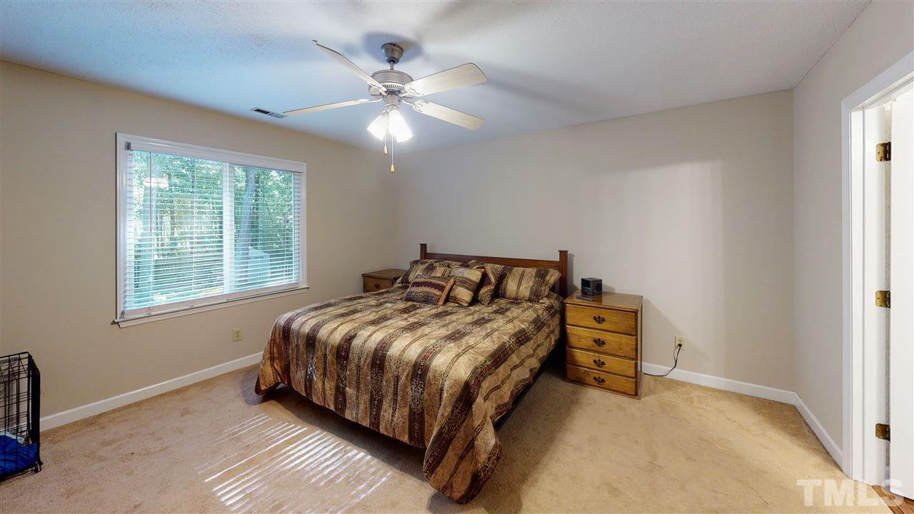 123 Abercrombie Road Wake Forest, NC 27587 - Photo 16 of 27 a bedroom with a bed and window