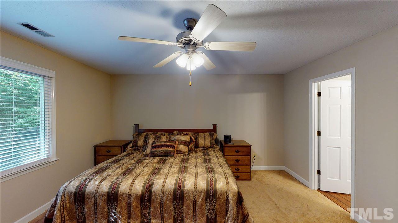 123 Abercrombie Road Wake Forest, NC 27587 - Photo 17 of 27 a bedroom with a bed and window