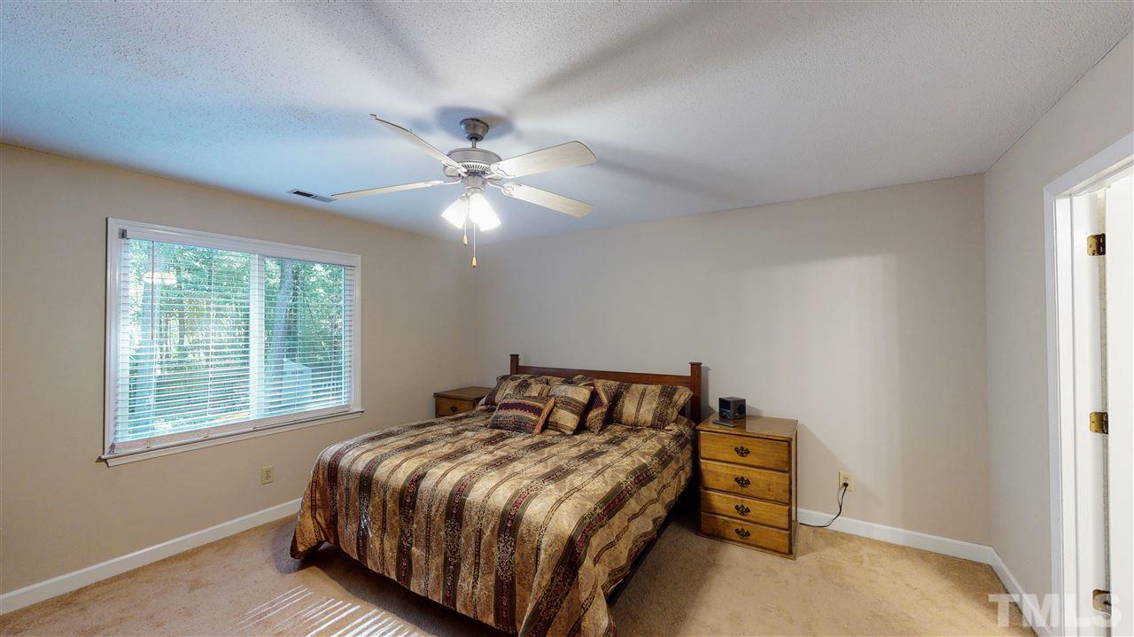 123 Abercrombie Road Wake Forest, NC 27587 - Photo 18 of 27 a bedroom with a bed and a window