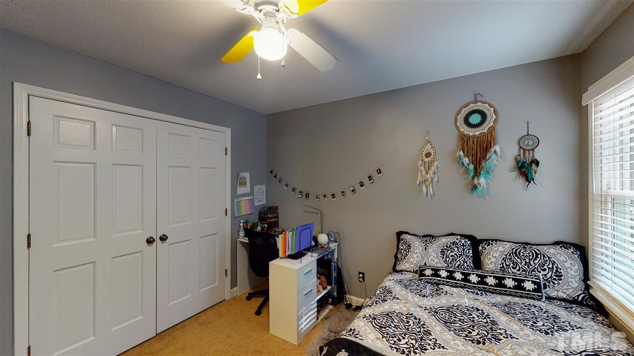 123 Abercrombie Road Wake Forest, NC 27587 - Photo 23 of 27 a bedroom with a bed and a window