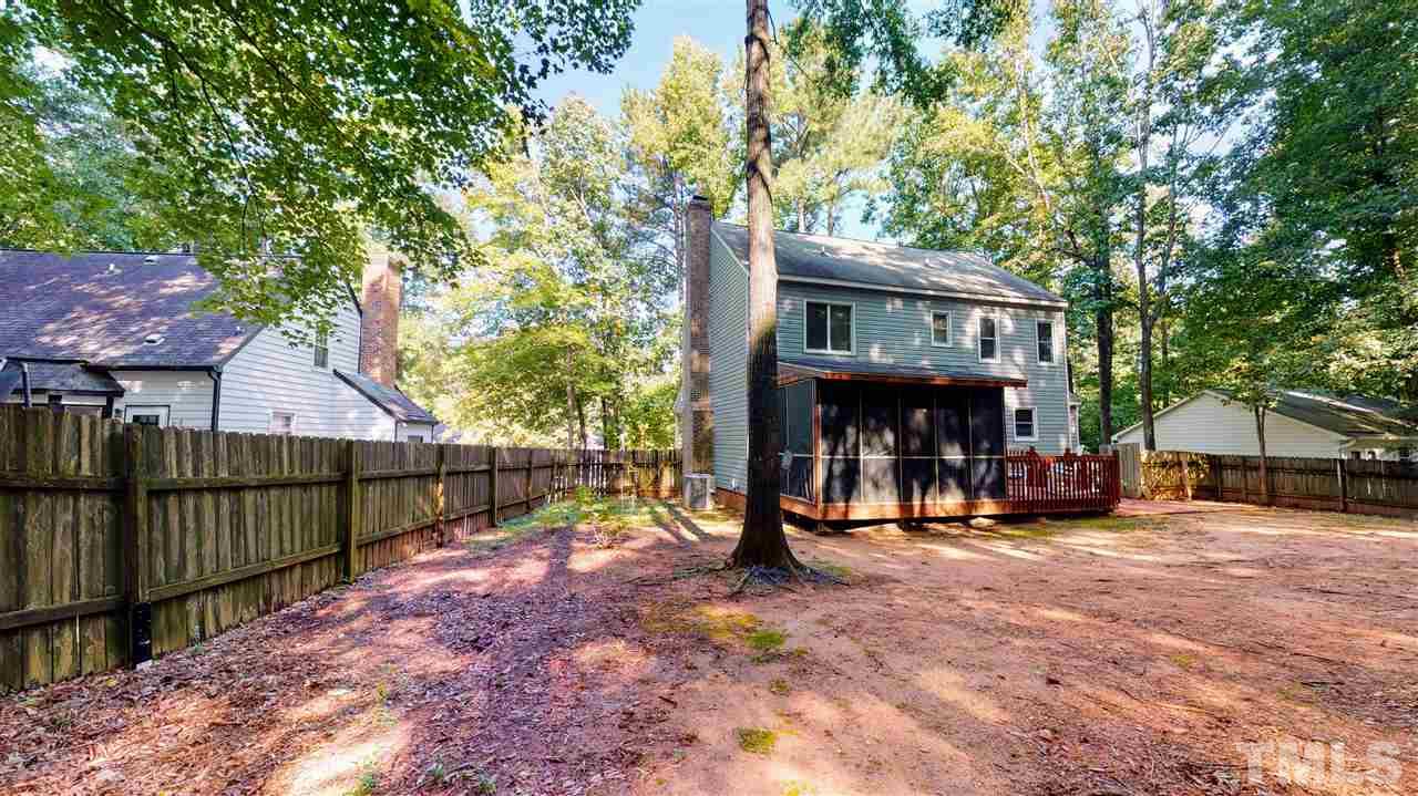 123 Abercrombie Road Wake Forest, NC 27587 - Photo 4 of 27 a view of a small house in the back yard