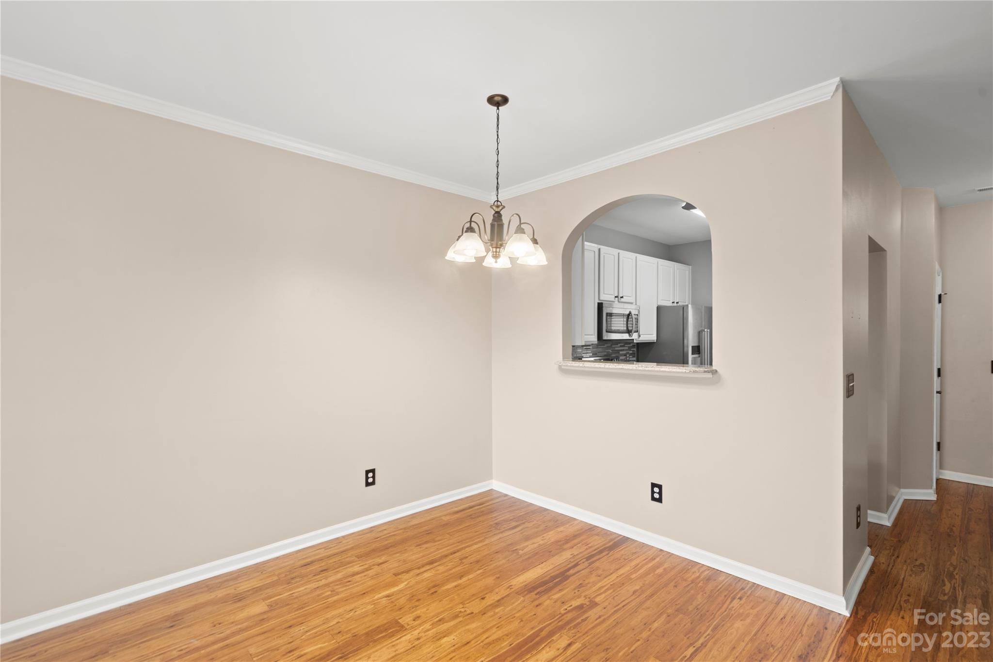 1103 Sienna Sand Way Fort Mill, SC 29708 - Photo 5 of 26 a view of a room with wooden floor and ceiling fan