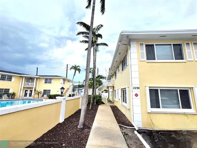a swimming pool view with a garden space