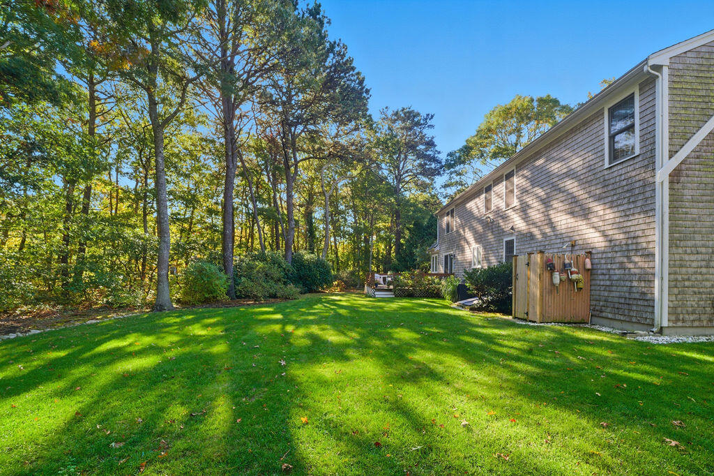 42 Eventide Lane Hyannis, MA 02601 - Photo 13 of 39 a view of a back yard of the house