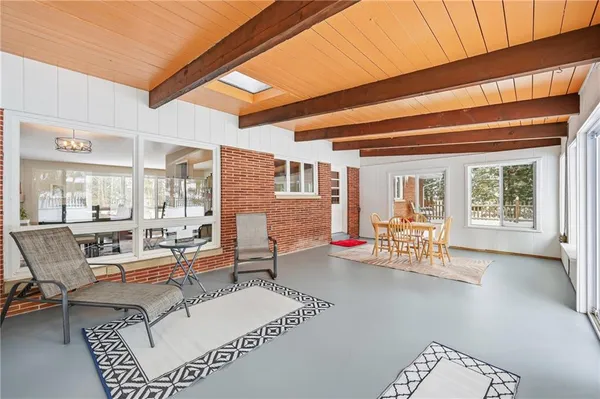 a room with furniture and a large window