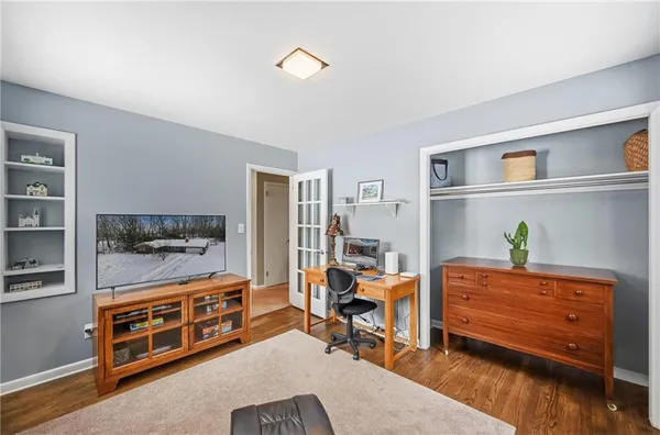 a bed room with a bed and a dresser