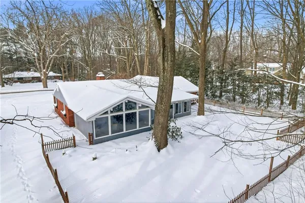 a view of a house with snow on the yard
