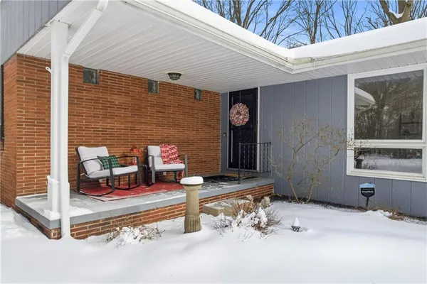 a front view of a house with a patio