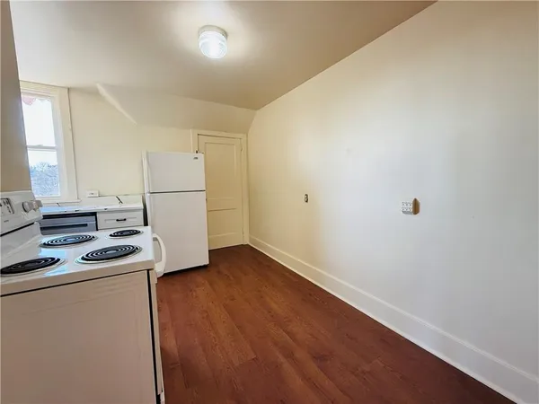 a view of kitchen with wooden floor
