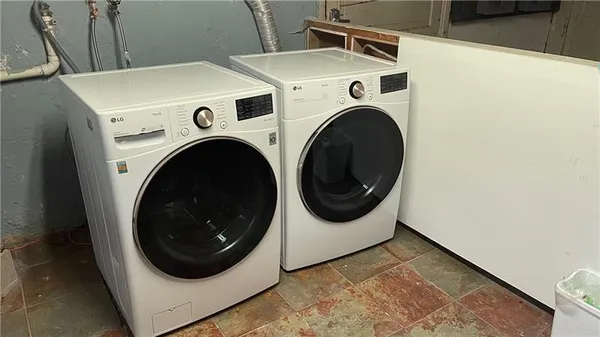 a utility room with dryer and washer