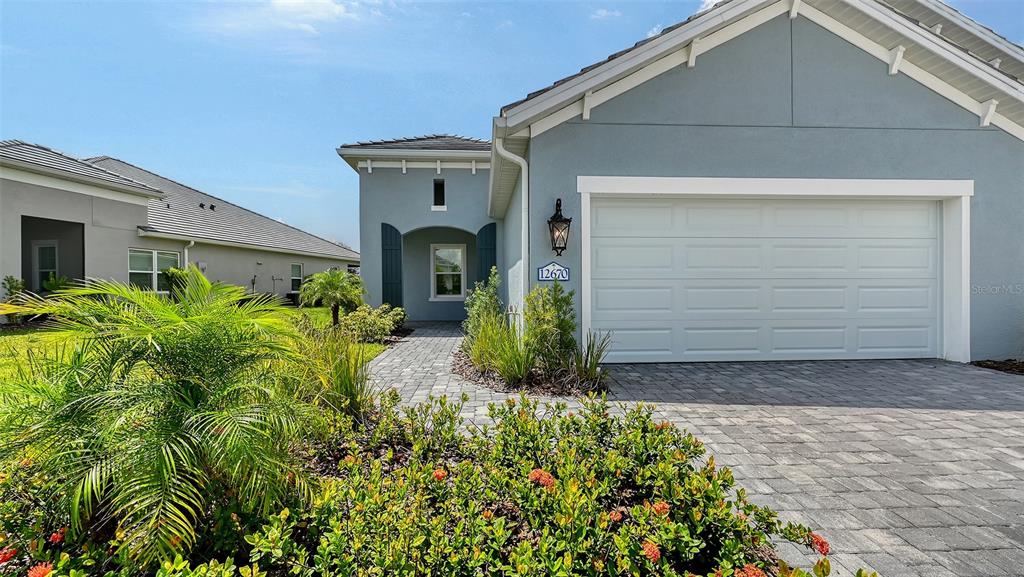 12670 Palatka Drive Venice, FL 34293 - Photo 1 of 1 a front view of a house with garden