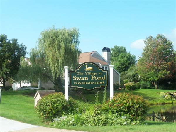 16 Canvasback Way, Unit 16 Walpole, MA 02081 - Photo 25 of 30 a view of a park that has a sign board