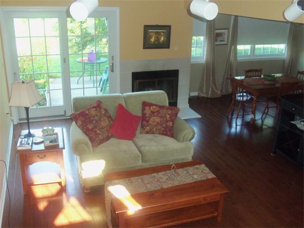 16 Canvasback Way, Unit 16 Walpole, MA 02081 - Photo 3 of 30 a living room with furniture fireplace and window