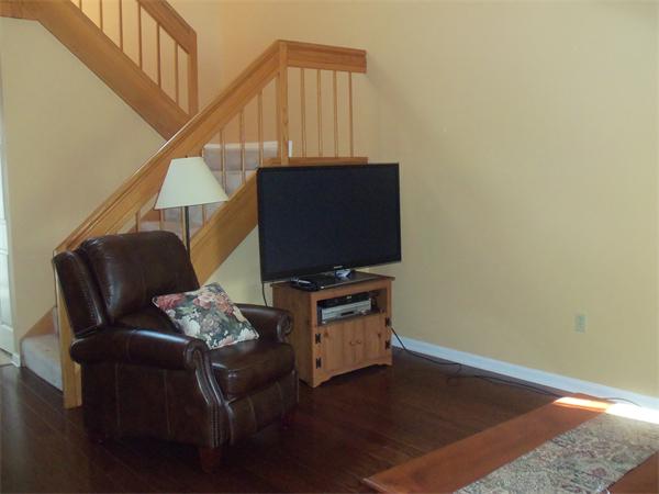 16 Canvasback Way, Unit 16 Walpole, MA 02081 - Photo 4 of 30 a living room with furniture and a flat screen tv