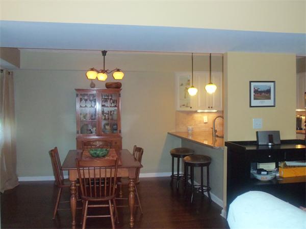 16 Canvasback Way, Unit 16 Walpole, MA 02081 - Photo 9 of 30 a view of a dining room with furniture and wooden floor