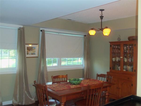 16 Canvasback Way, Unit 16 Walpole, MA 02081 - Photo 10 of 30 a view of a dining room with a table and chairs