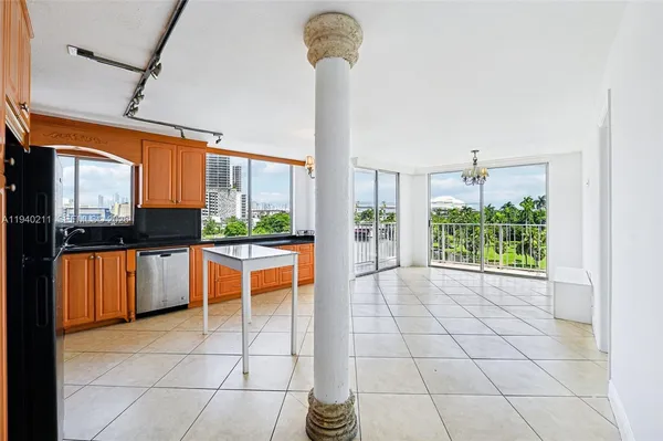 a view of a kitchen with furniture and a window