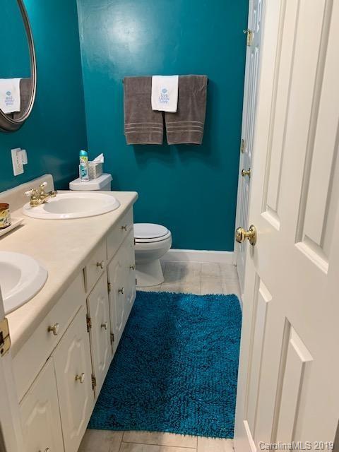 319 Happy Valley Road Union, SC 29379 - Photo 3 of 6 a bathroom with a sink and a mirror