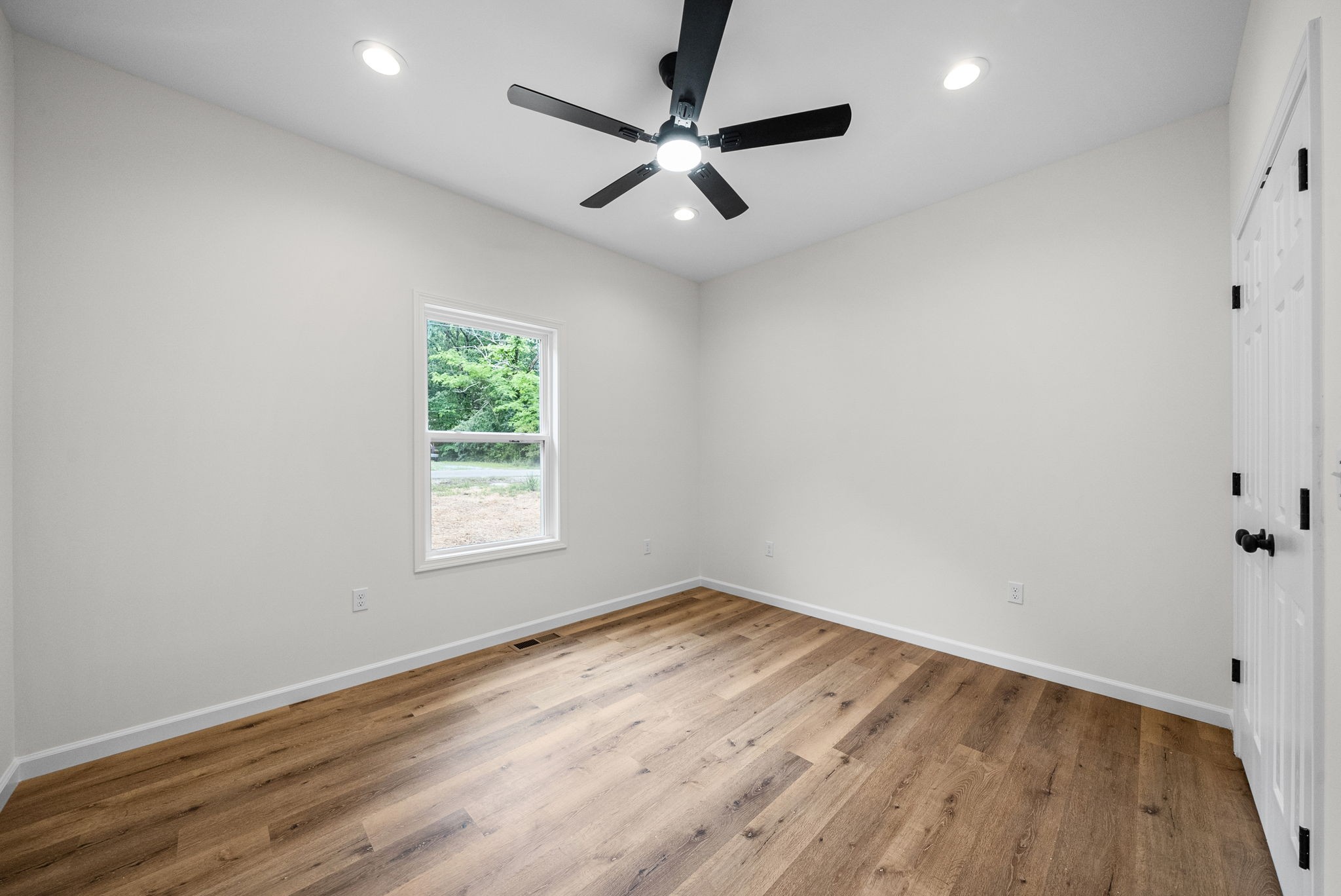 690 Brazzle Road Waverly, TN 37185 - Photo 25 of 35 wooden floor in an empty room with a window