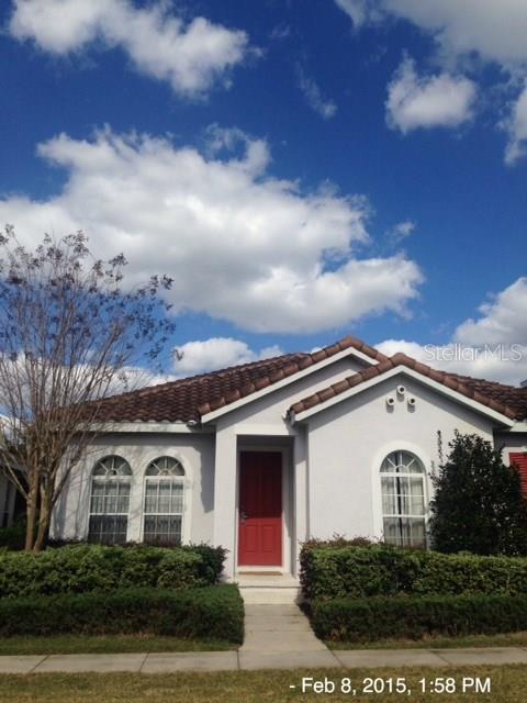 7417 Soiree Way Reunion, FL 34747 - Photo 1 of 1 a front view of a house with a garden