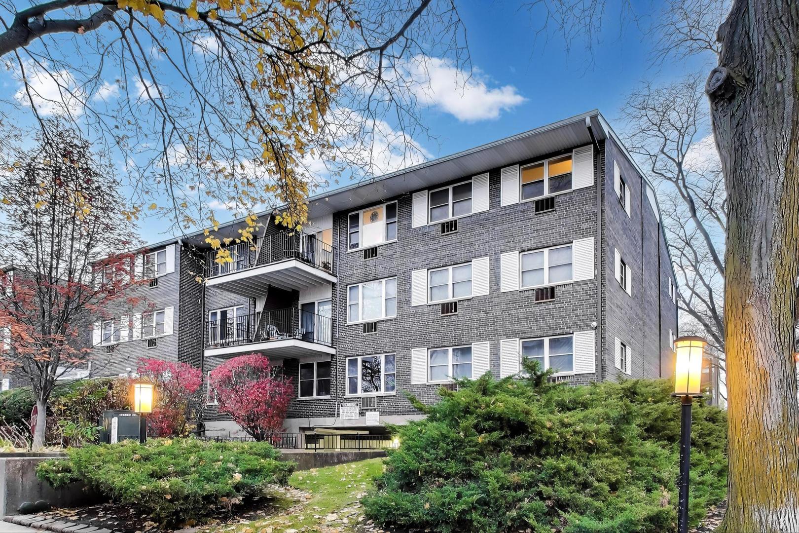 a front view of a building with garden