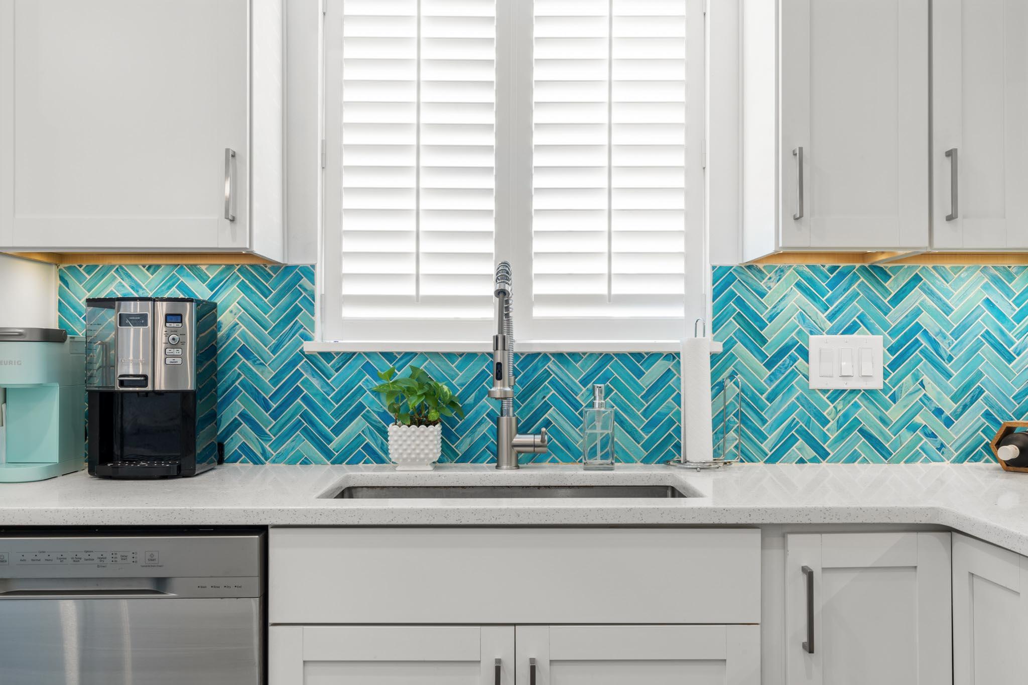 130 Durango Road, Unit 104 Destin, FL 32541 - Photo 11 of 46 a kitchen with a window and sink