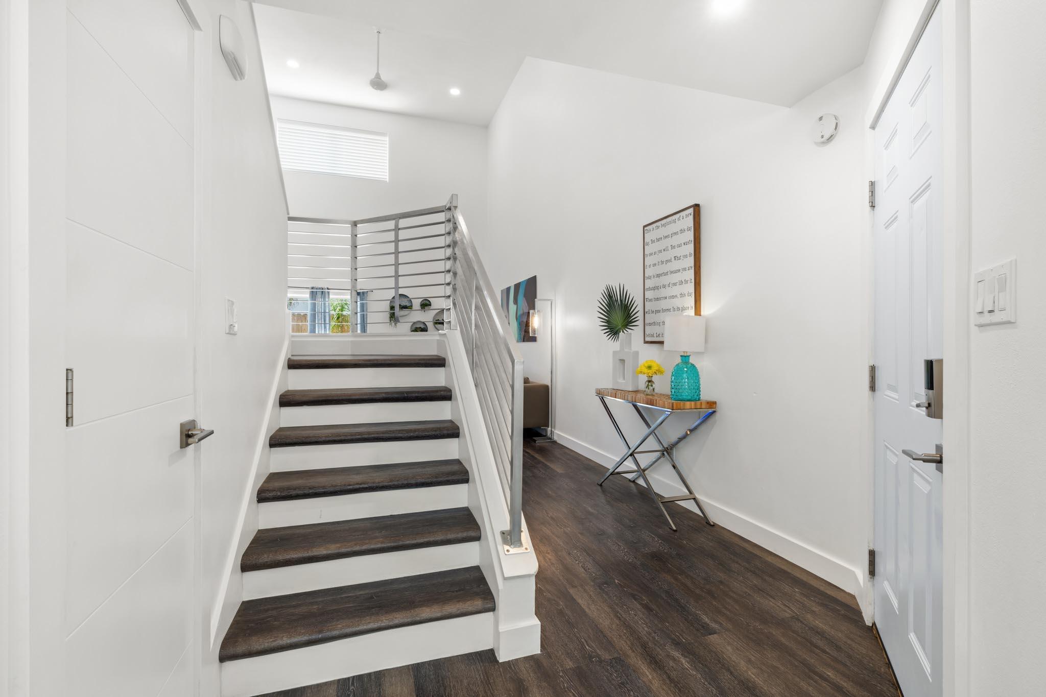 130 Durango Road, Unit 104 Destin, FL 32541 - Photo 14 of 46 a view of entryway with furniture and wooden floor