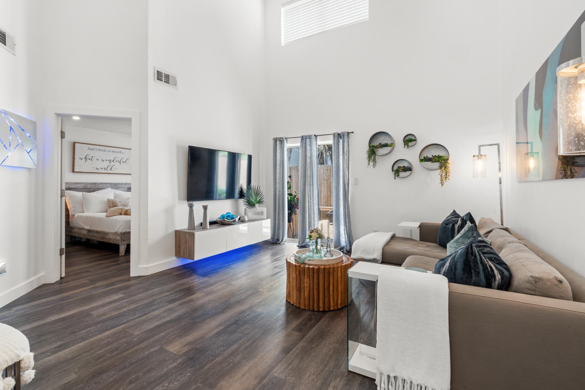 130 Durango Road, Unit 104 Destin, FL 32541 - Photo 15 of 46 a living room with furniture and a flat screen tv