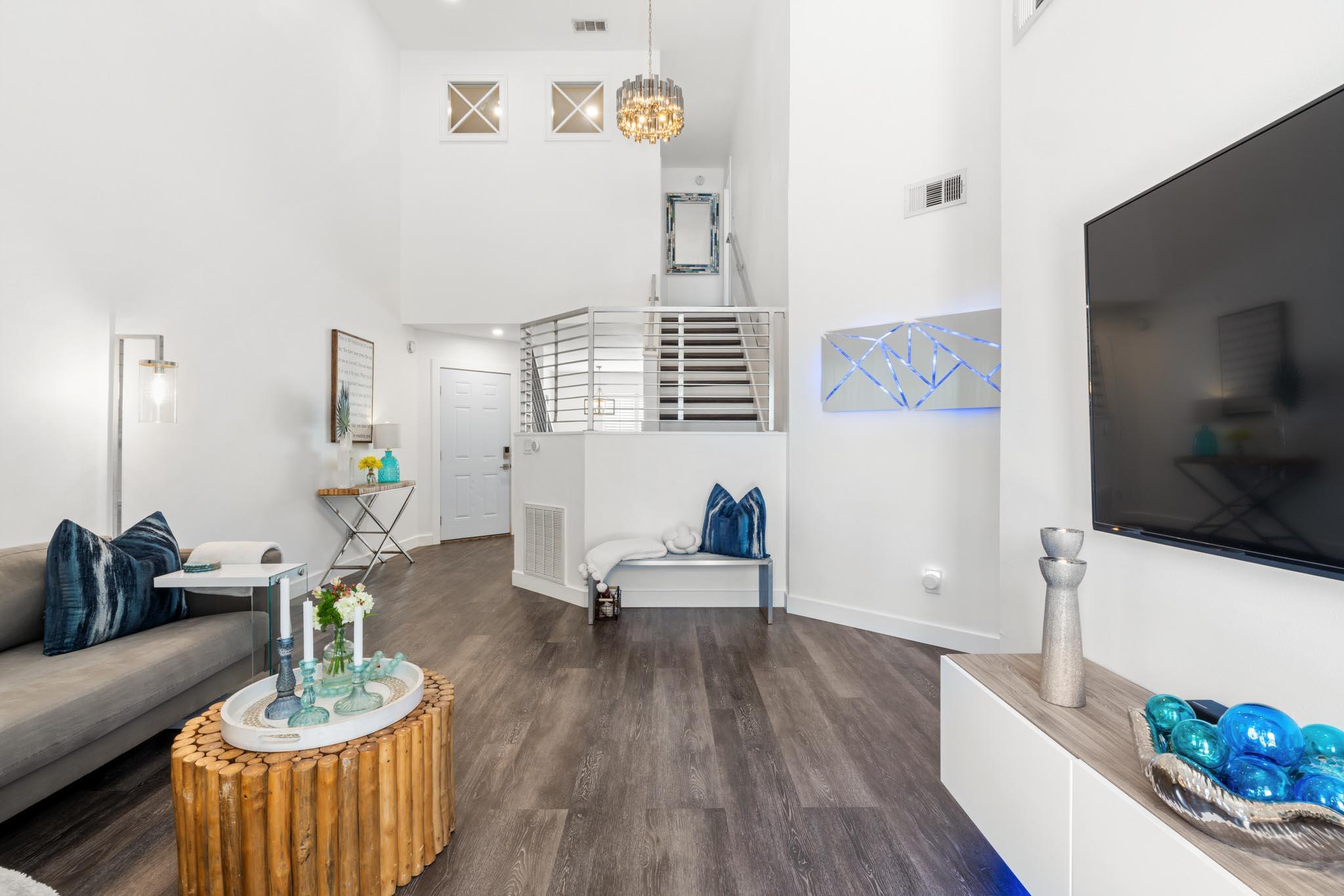 130 Durango Road, Unit 104 Destin, FL 32541 - Photo 17 of 46 a living room with furniture and a flat screen tv
