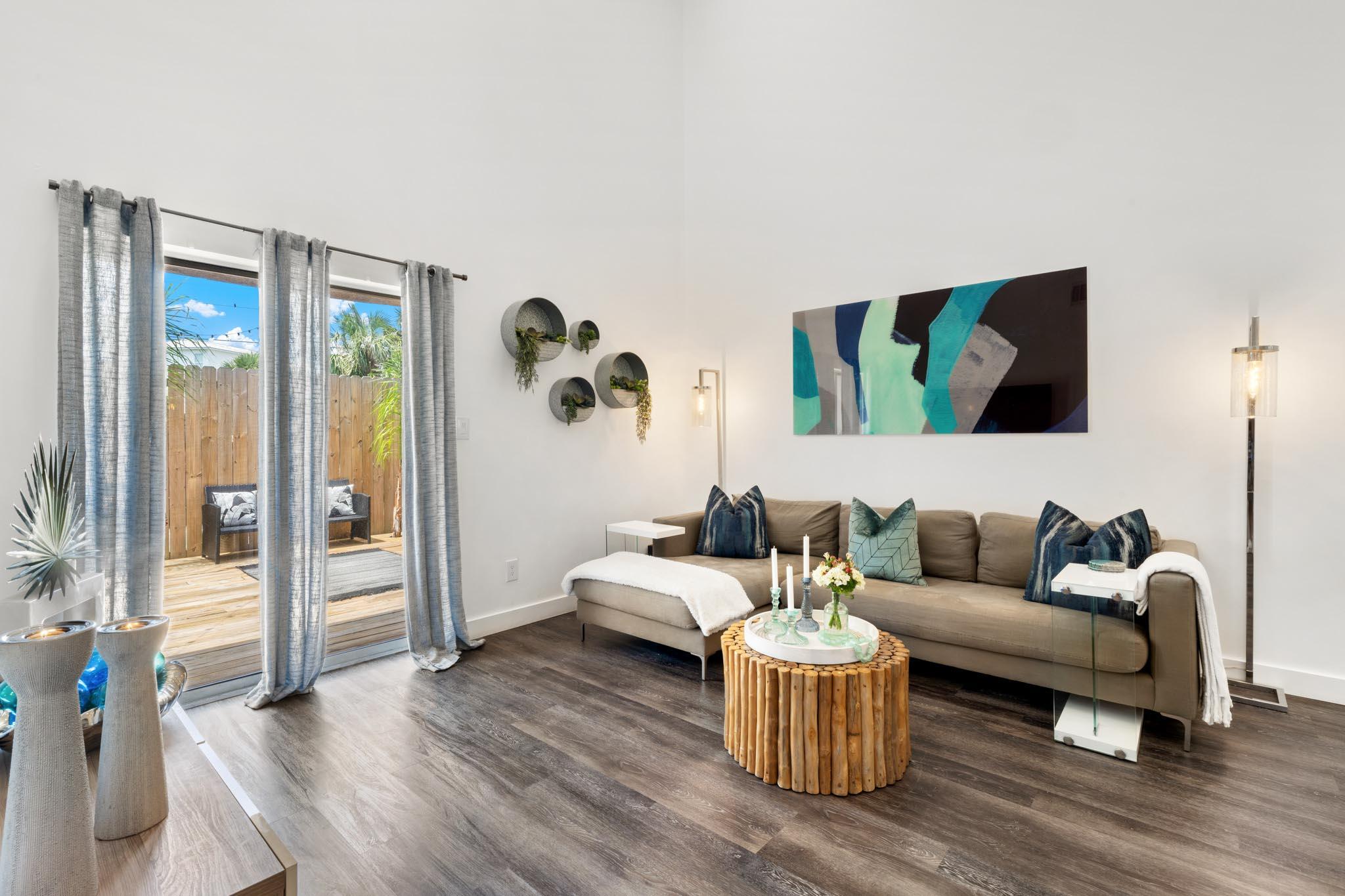 130 Durango Road, Unit 104 Destin, FL 32541 - Photo 22 of 46 a living room with furniture and wooden floor