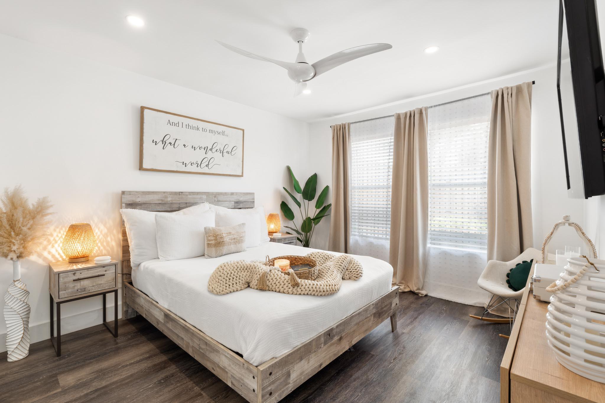 130 Durango Road, Unit 104 Destin, FL 32541 - Photo 23 of 46 a bedroom with a bed and wooden floor