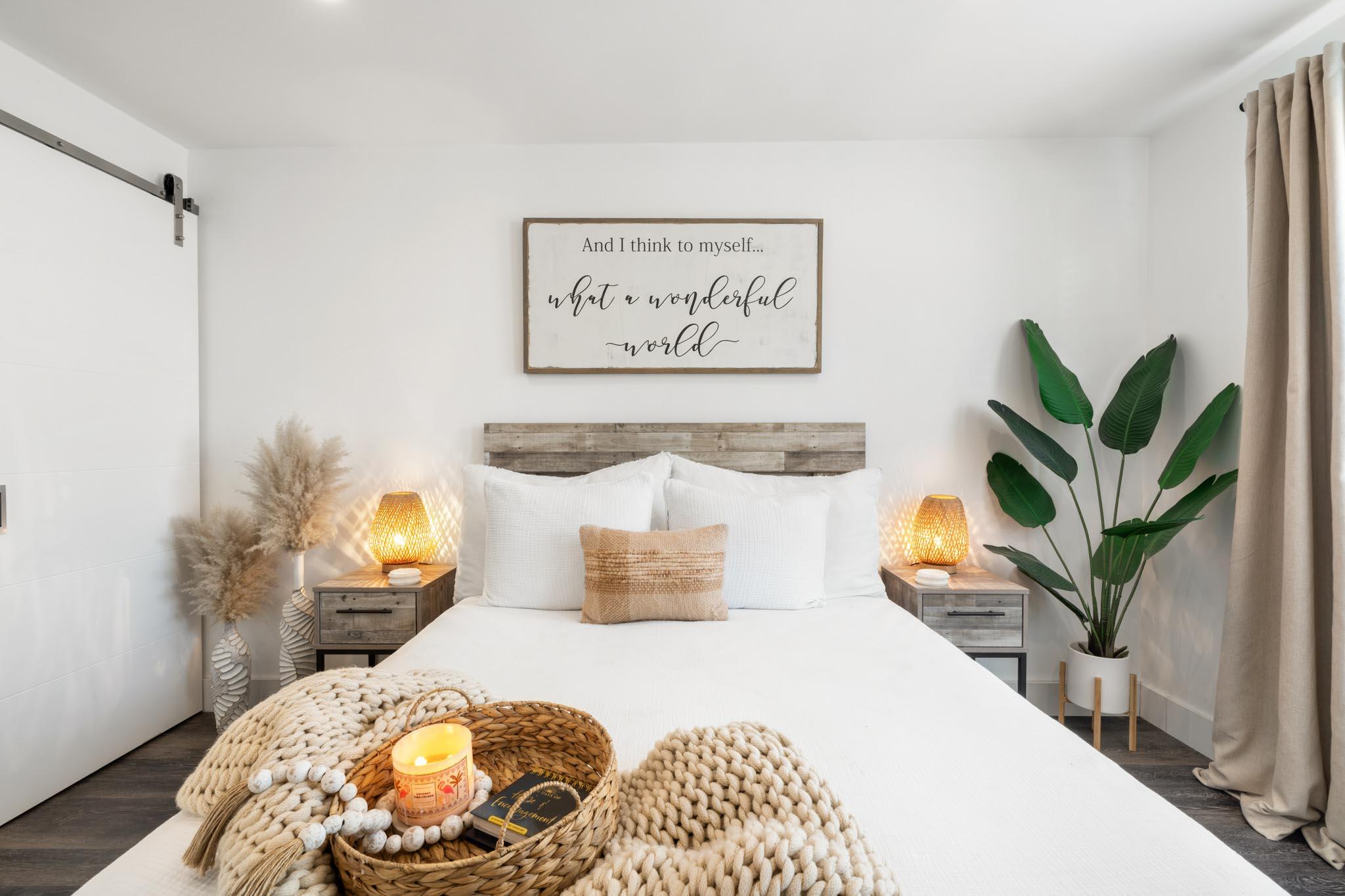 130 Durango Road, Unit 104 Destin, FL 32541 - Photo 24 of 46 a bedroom with a bed and a potted plant