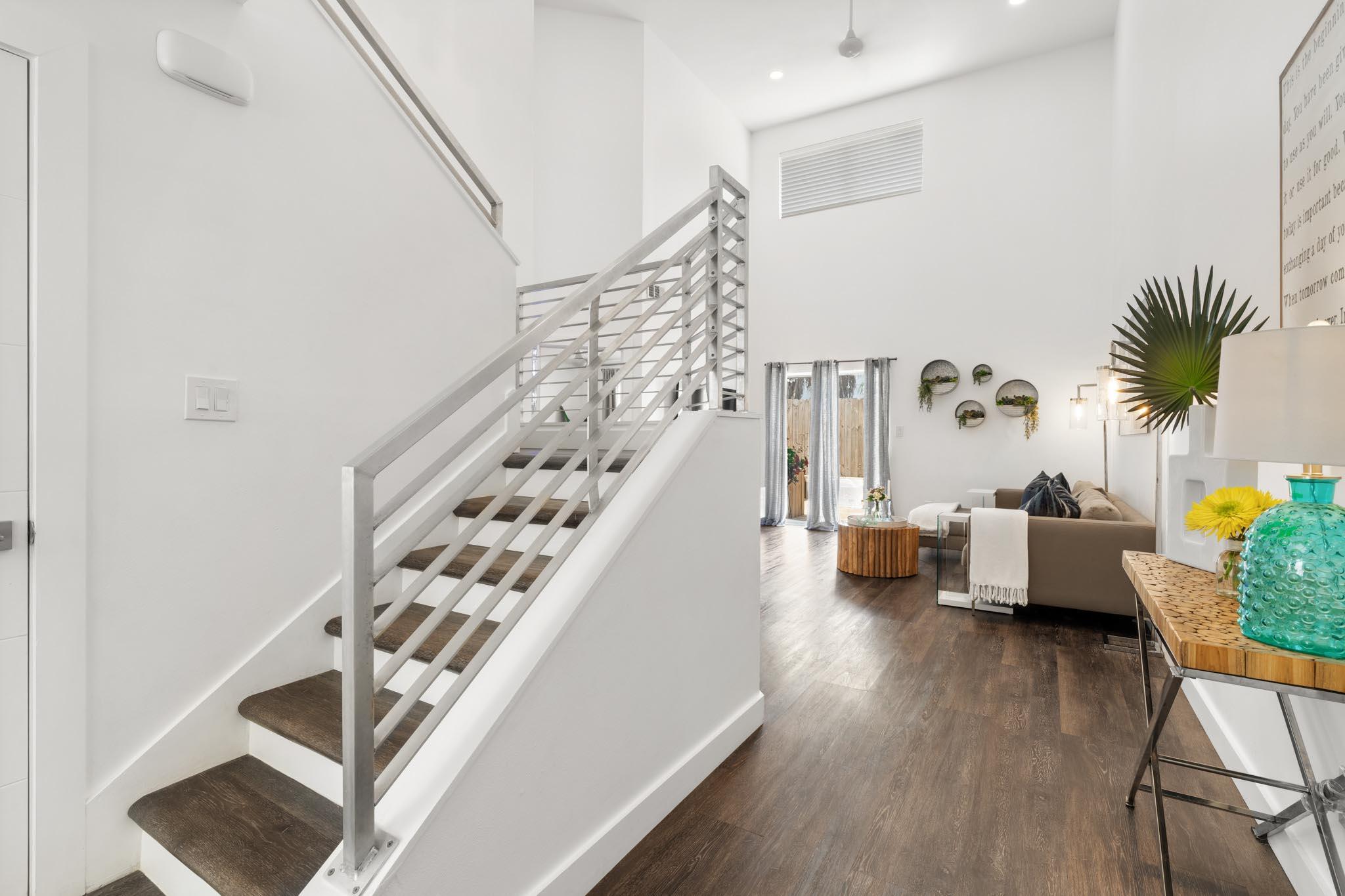 130 Durango Road, Unit 104 Destin, FL 32541 - Photo 3 of 46 a living room with furniture and wooden floor