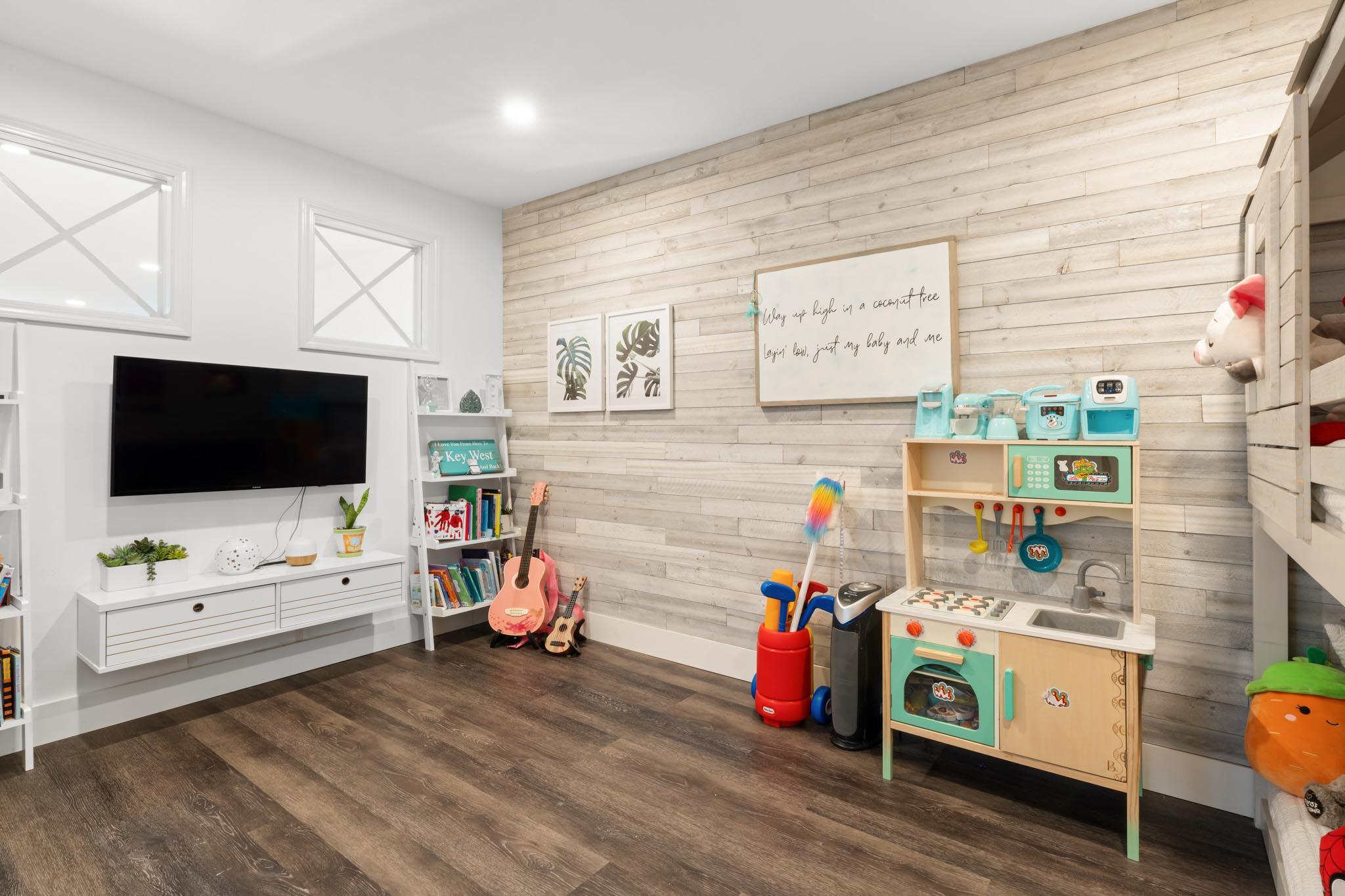 130 Durango Road, Unit 104 Destin, FL 32541 - Photo 32 of 46 a living room with furniture and a flat screen tv