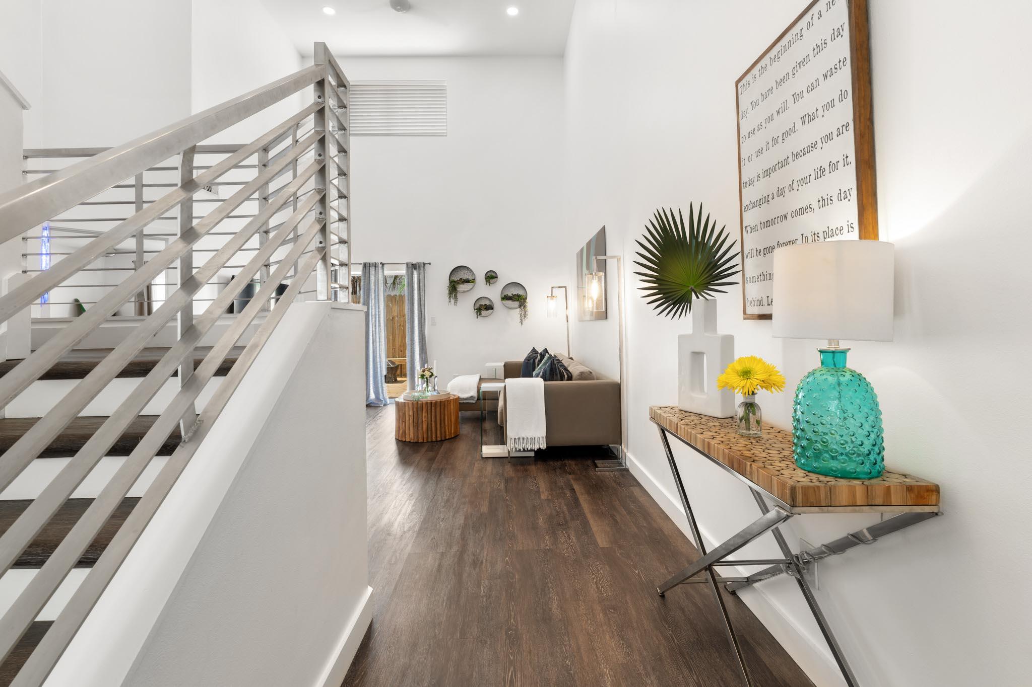 130 Durango Road, Unit 104 Destin, FL 32541 - Photo 4 of 46 a living room with furniture and a potted plant