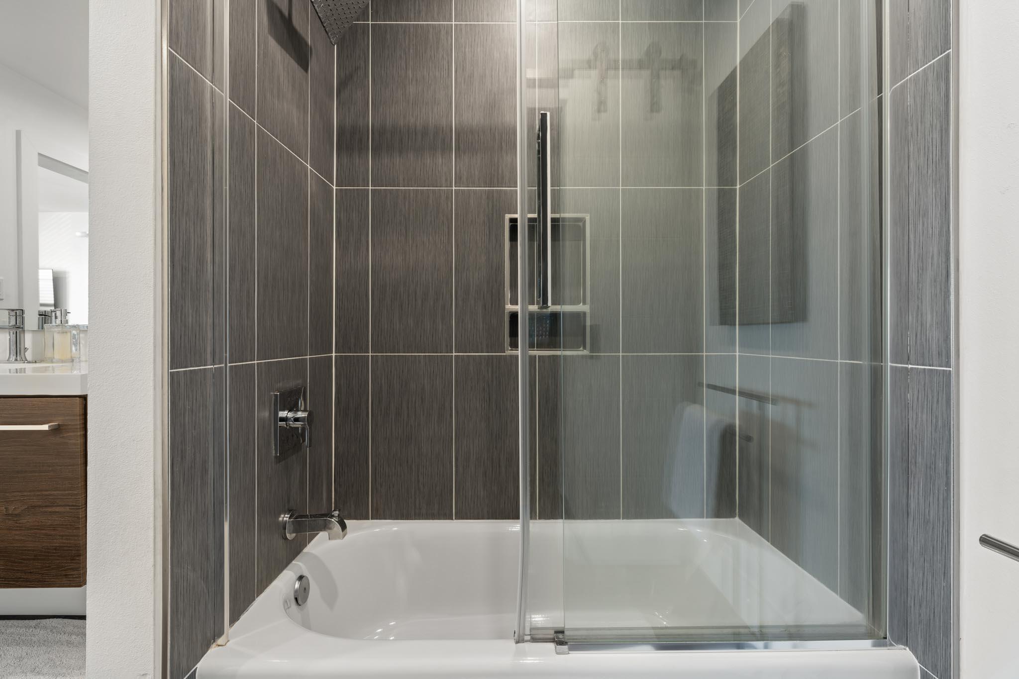 130 Durango Road, Unit 104 Destin, FL 32541 - Photo 42 of 46 a bathroom with a bathtub