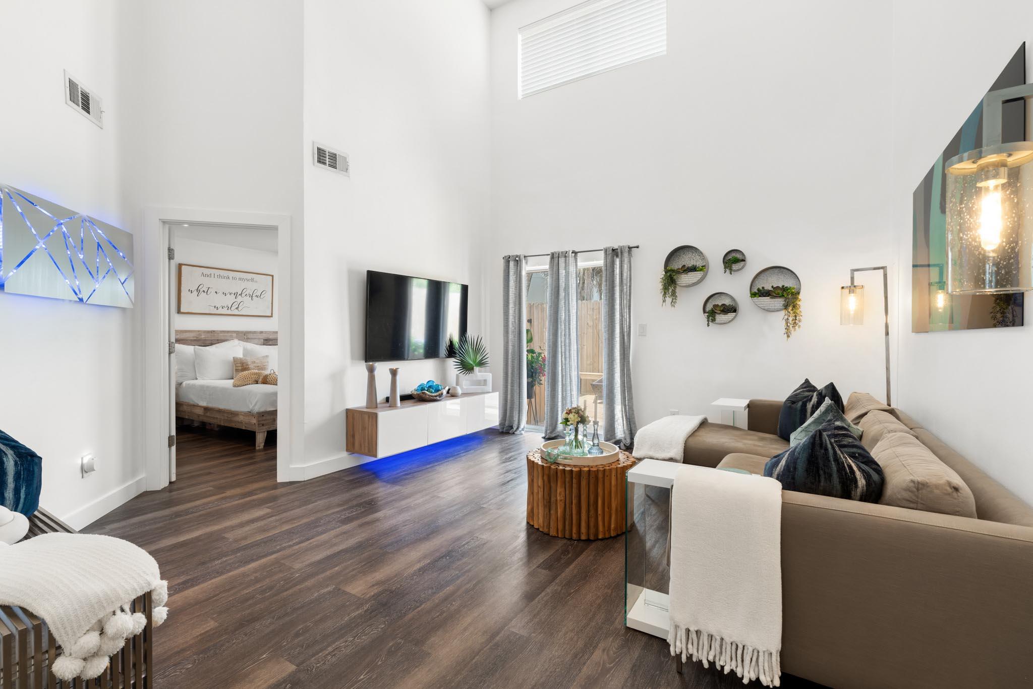 130 Durango Road, Unit 104 Destin, FL 32541 - Photo 5 of 46 a living room with furniture and a flat screen tv