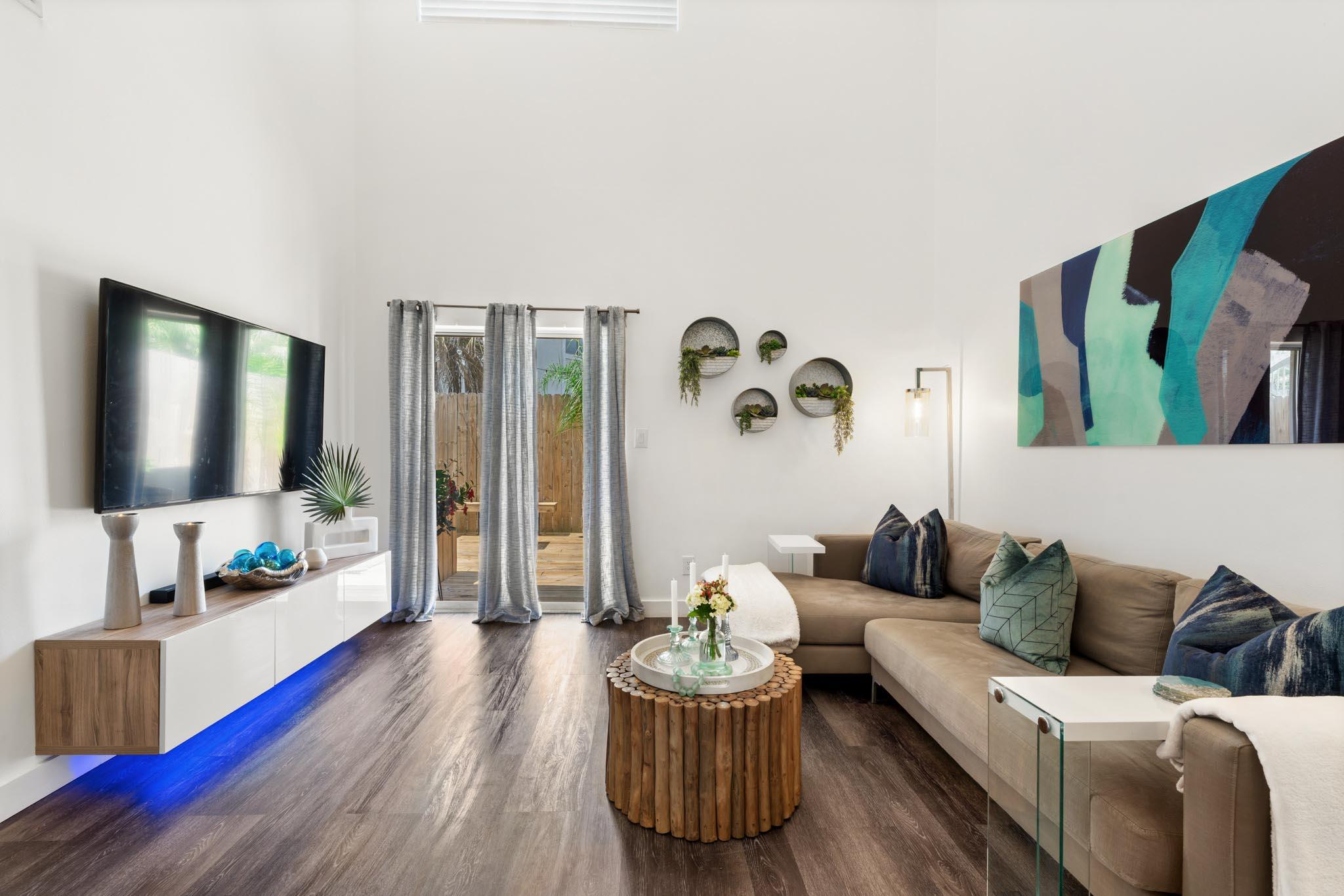 130 Durango Road, Unit 104 Destin, FL 32541 - Photo 6 of 46 a living room with furniture and wooden floor