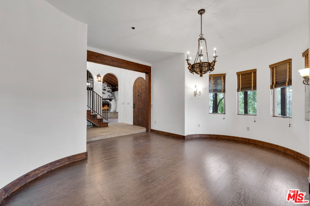 32140 Windrush Road Agua Dulce, CA 91390 - Photo 13 of 41 an empty room with wooden floor and windows