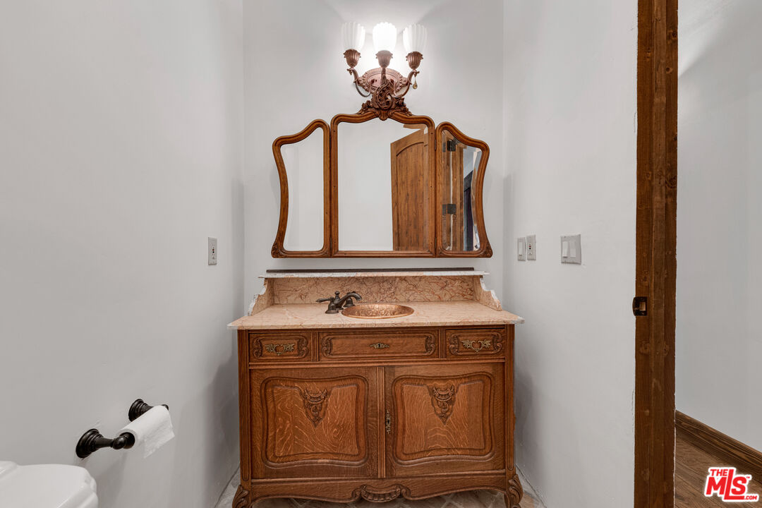 32140 Windrush Road Agua Dulce, CA 91390 - Photo 18 of 41 a bathroom with a sink and a mirror