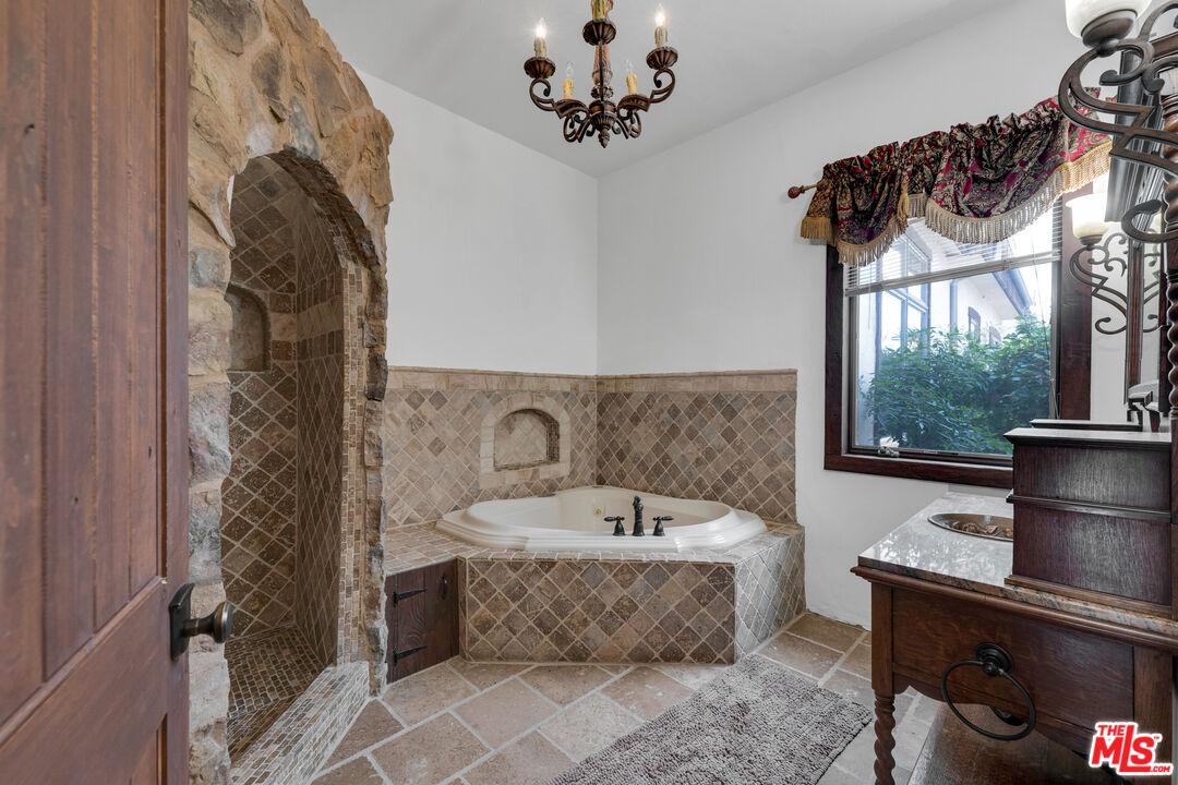 32140 Windrush Road Agua Dulce, CA 91390 - Photo 22 of 41 a bathroom with a bathtub sink and mirror