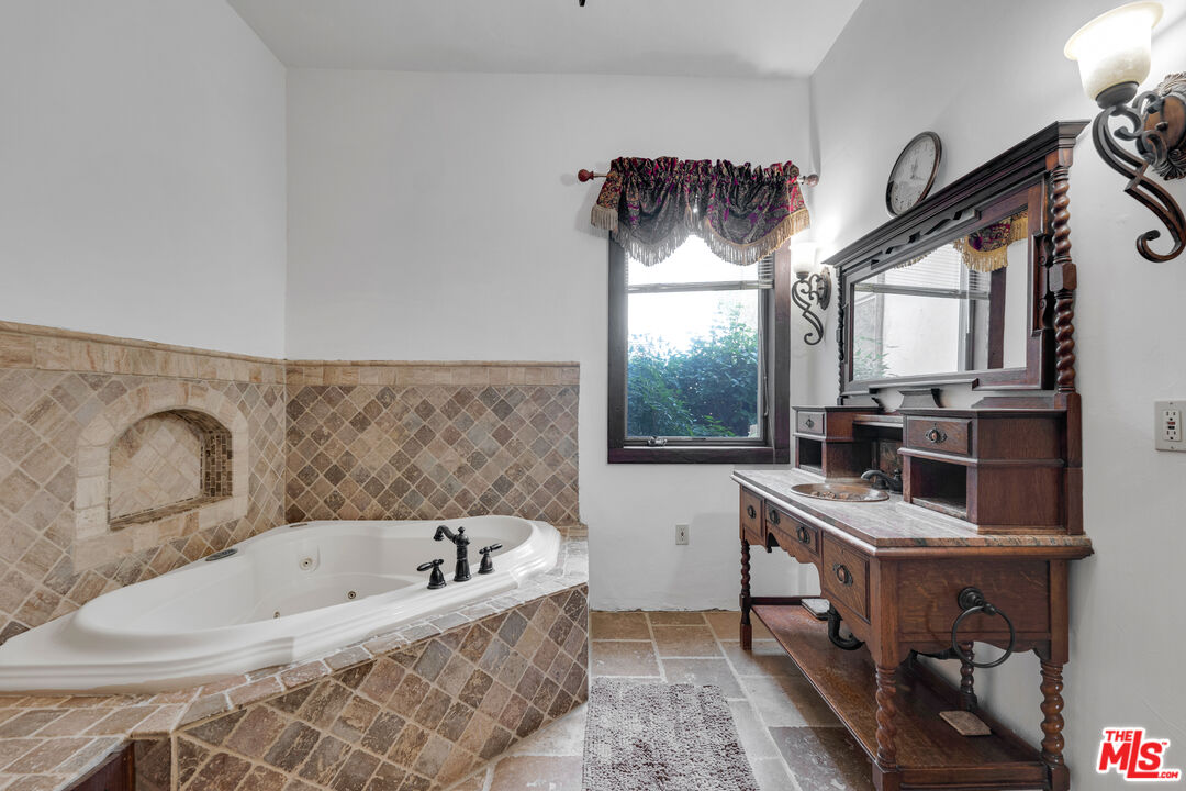 32140 Windrush Road Agua Dulce, CA 91390 - Photo 23 of 41 a bathroom with a bathtub and a window