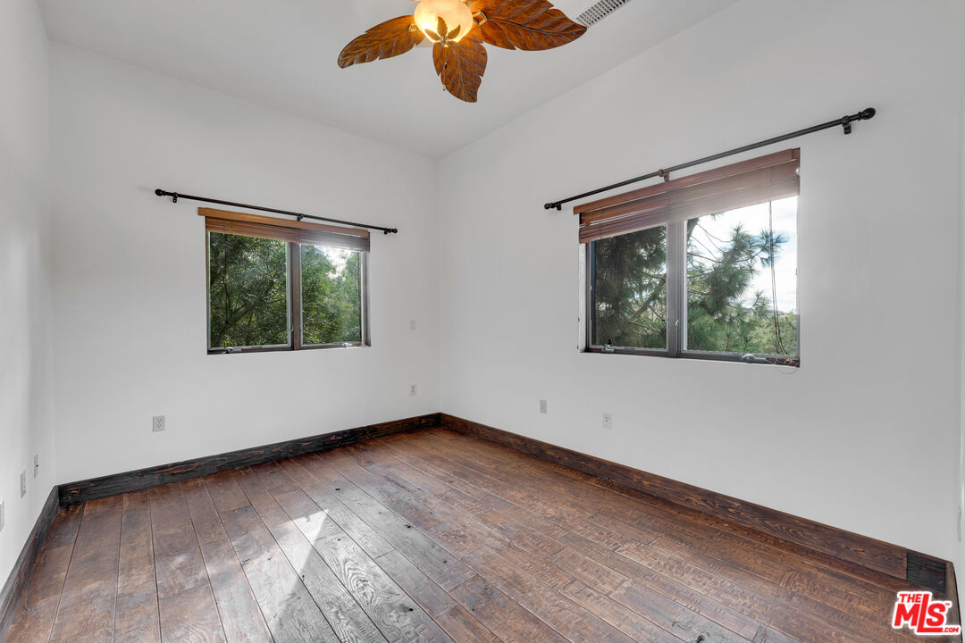 32140 Windrush Road Agua Dulce, CA 91390 - Photo 26 of 41 wooden floor in an empty room with a window