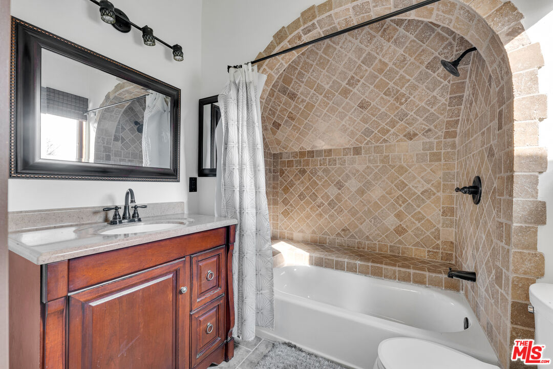 32140 Windrush Road Agua Dulce, CA 91390 - Photo 29 of 41 a bathroom with a granite countertop sink toilet and shower