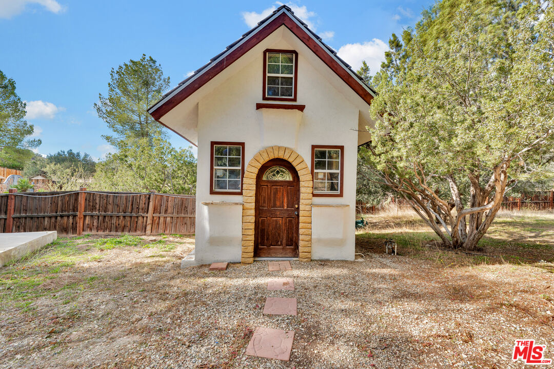 32140 Windrush Road Agua Dulce, CA 91390 - Photo 37 of 41 a view of front a house with a yard