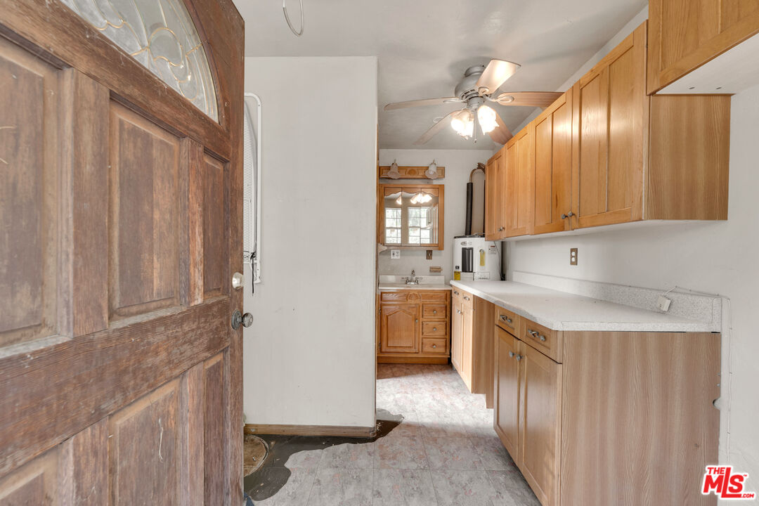 32140 Windrush Road Agua Dulce, CA 91390 - Photo 38 of 41 a kitchen with stainless steel appliances granite countertop a sink a stove and a refrigerator